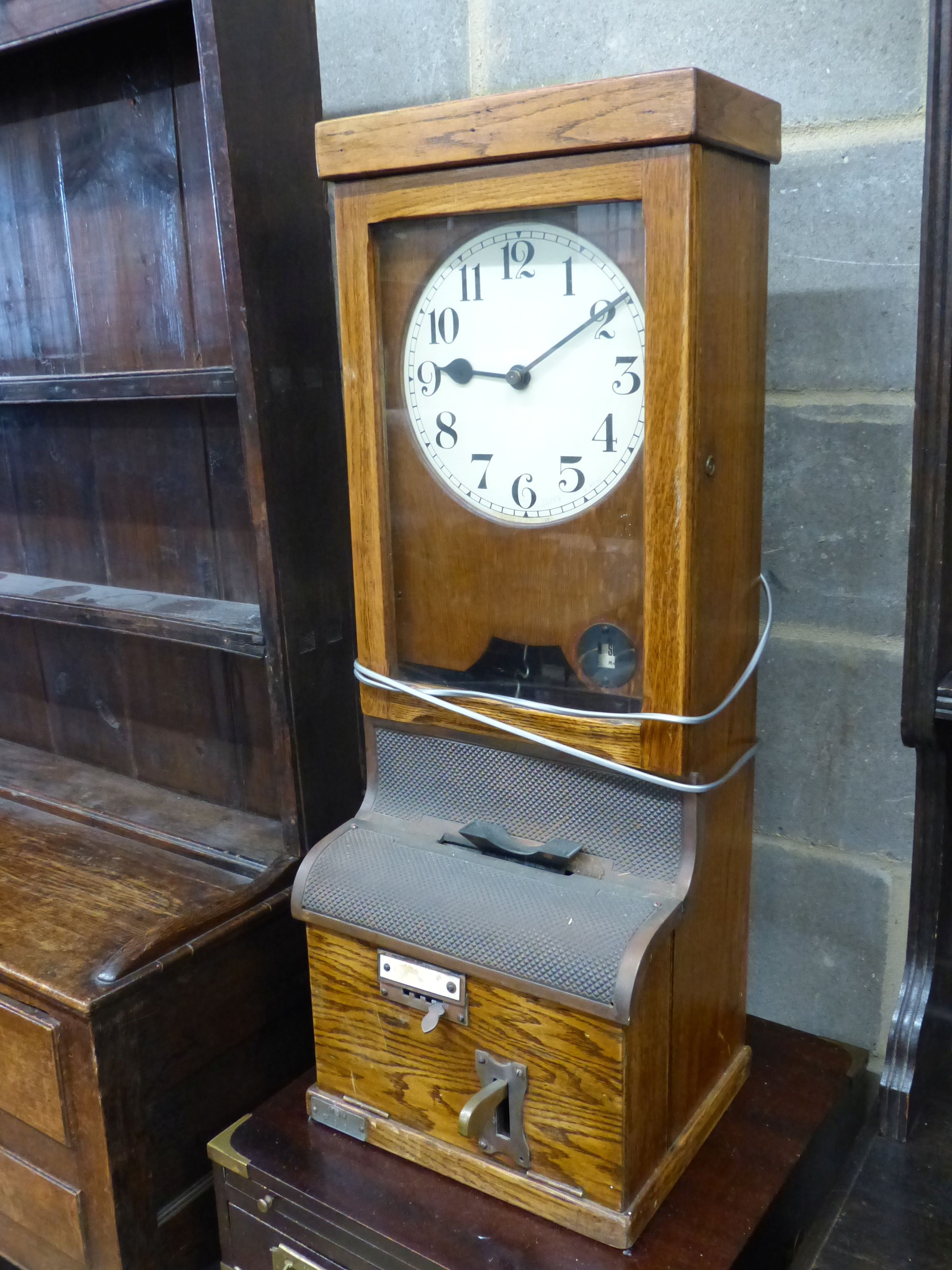 A vintage oak-cased electric wall factory time recorder clock, circa 1930